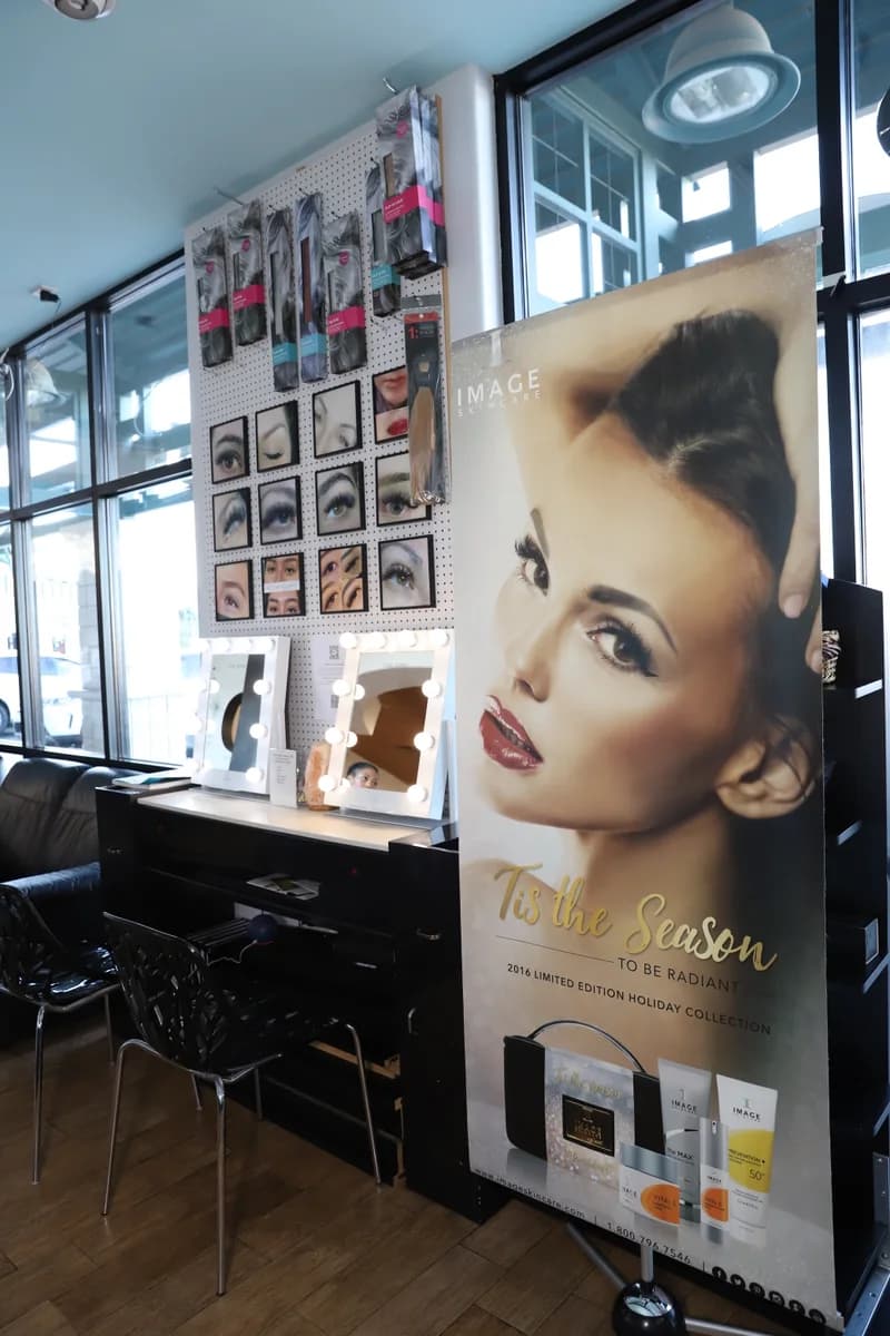Lash aftercare products and skincare on display at the front of the salon.